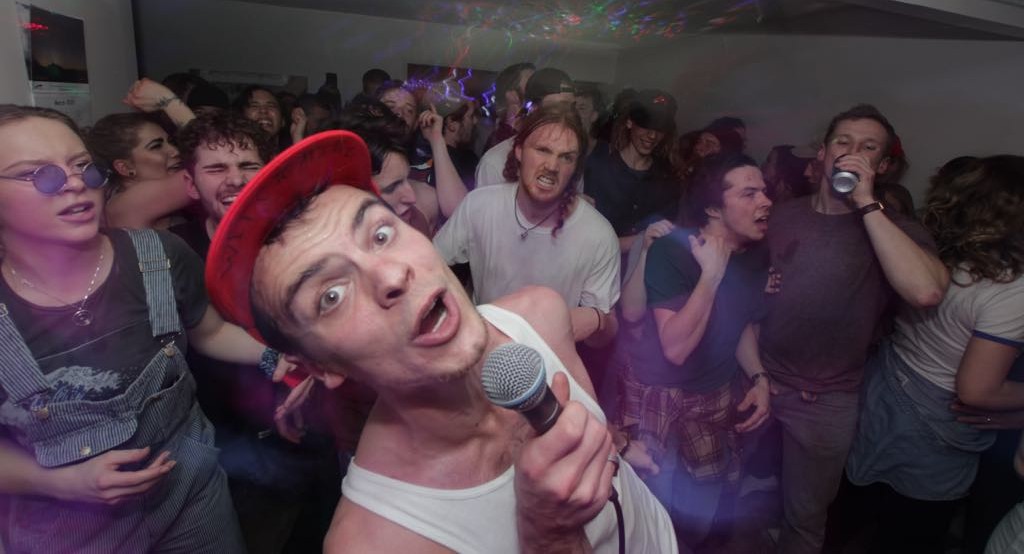A high energy singer performing.